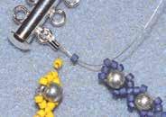 Attach each strand to the clasp: Wire guardians are used to attach