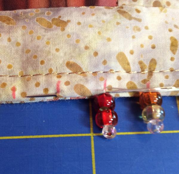 Repeat to sew the next bead group.