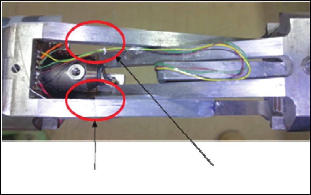 Application of Fiber Bragg Grating Sensors for Dynamic Tests in Wind Tunnels Figure 2: Schematic of FBG system. Figure 3: Photograph of Cross Flexure Pivot with installed FBG and RSG.