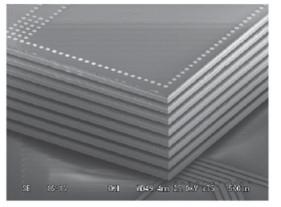 Figure 71: SEM Picture of 8-strata Stacked Chips with TSVs on Interposer Layer [128] This type of heterogeneous integration approach was a part of the DARPA Scalable Millimeter Wave Architectures for