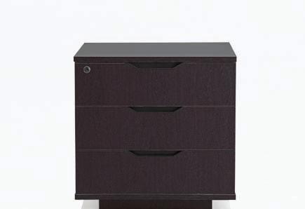smooth dark wood cabinets, this desk emerges as an object