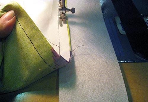 Lay the sewn top of the panel over the header tape. The bottom of the header strip should line up with your sewn seam as shown in the photo below.