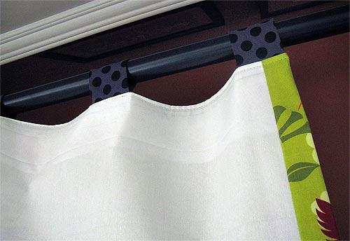 2. Pull the tabs out firmly and loop each to the front.