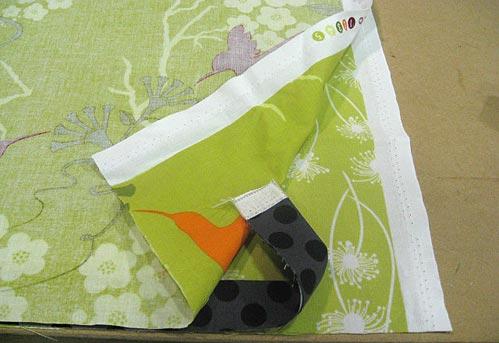 5. Using a ½" seam allowance, sew the top fabric to the bottom fabric. Press the flange down and the seam allowance up. 6.
