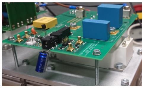 Capacitors are placed directly on the top of the SiC-MOSFET to provide a low-inductive current path. The high-frequency part of the management circuitry occupies area 4.