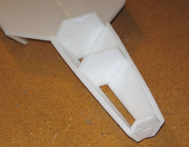 12. Use a sanding block to lightly sand the top of the lower forward fuselage until it is flat and even.