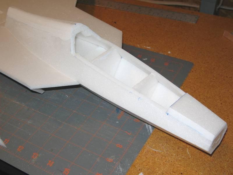 Note how the fuselage sides curve inward as they run aft you can heat form the foam slightly to attain this curvature. Pins can be used to hold the foam in place as the glue cures.