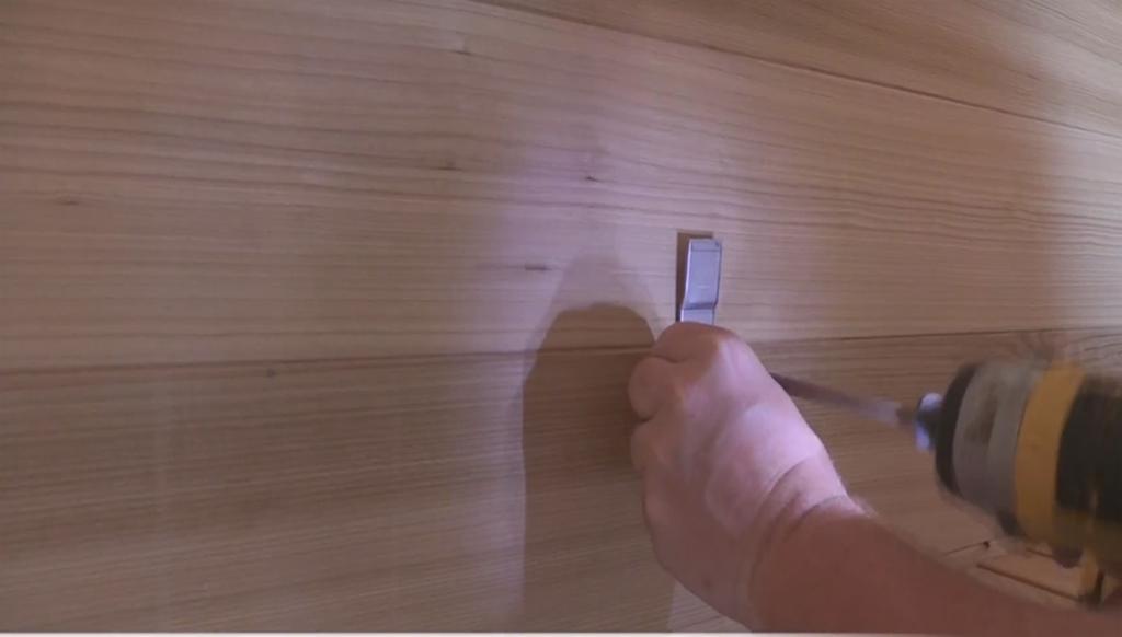 Attach brackets to wall of sauna with 1 ½ screws.