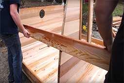 Use a stave as a support brace to steady the wall segments, as