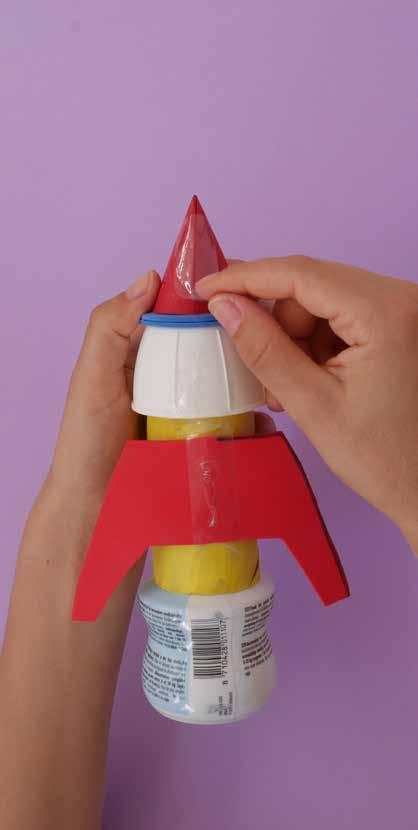 Use glue to stick the nose cone onto the top of the cap, and sticky tape to stick