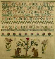 Right, Mary Hay-1813 is a small Scottish sampler that features the Coat of Arms of the Fleshers,