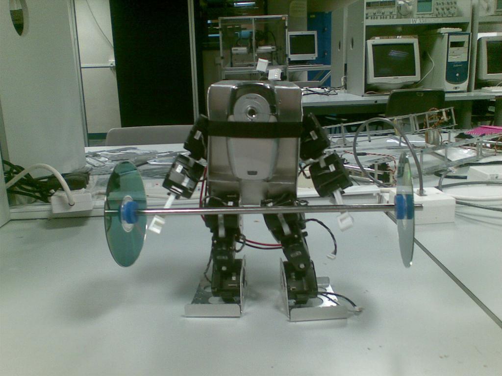 Figure 2: A robot carrying the lifting bar below and above the head.
