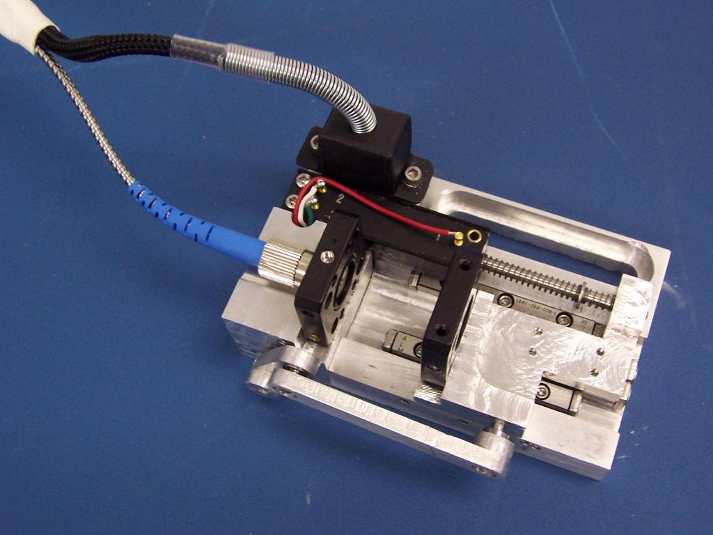 Lens Fiber Output Potentiometer Bearing Slides Motor Actuation Arm Figure 4. DVM parts 4.