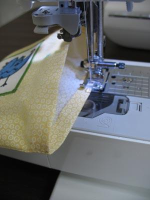 Se a 1/8 inch seam around the folded edges of each side -- but don't sew the