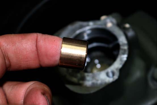 16. Take the 5X Racing Bronze Shifter Bushing and install it within the shifter bushing cup at the
