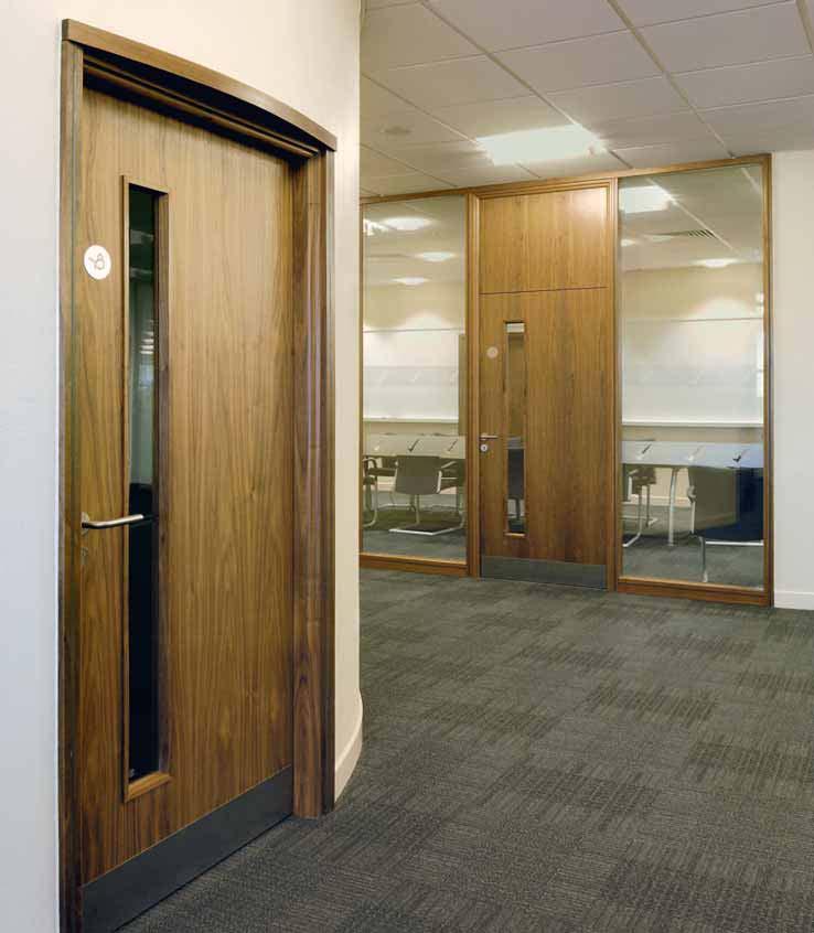 American Black Walnut veneered doors with rectangular vision panels Doors Virtually unlimited decorative styles and moods can be captured with Komfort's veneered doors.