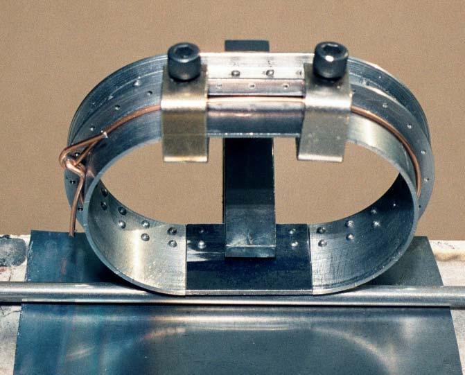 Place the assembly on its side, on top of a ¼" steel plate, and a ¼" diameter steel bar to support the bottom of the Tender Water Tabk Funnel plate, and clamp to the edge of the welding table with a