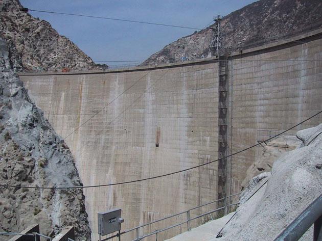 2 that is about 2 meters below the crest of the dam. Two different views of Pacoima Dam are shown in Figure 1.1. On February 9, 1971, Pacoima Dam was shaken by the magnitude 6.
