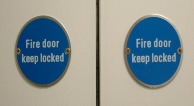 19 Appropriate fire door signage is not present.