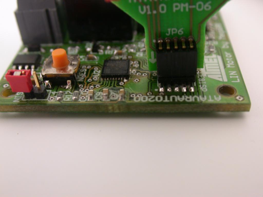 To plug the ATAVRAUTO900 connector to the board, the arrow (on the adaptator) has to be in front of the point (on the board). Figure 2-10.