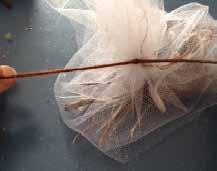 - tulle or cheese cloth, twigs, yarn, dryer lint, and scissors Step 1: