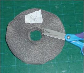 With a scissor, carefully make a few cuts from the inner (empty)