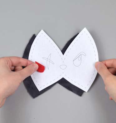 Then carefully pull the paper pattern away while holding the piece in place.