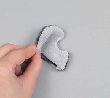 Use it as a guide to fold the ear with inner ear fabrics facing. b.
