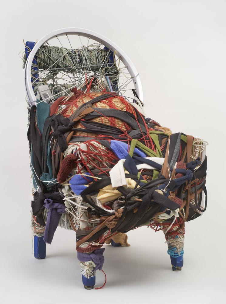 Description of the Artwork This sculpture is made from several everyday objects. The largest, a wooden chair with royal blue paint, provides the structural framework.
