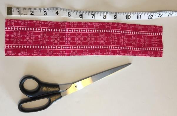 To make the strap cut a strip of fabric the length you require by 8cm