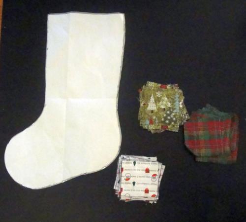 template (below) Something to make a loop to hang stocking from, i.e. large grommet, yarn, leftover fabric, etc.
