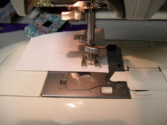 You could just as easily press down about 1/8, press again about 1/4 and top stitch.