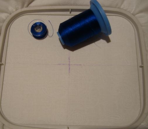 Make a quilt sandwich with the marked fabric on top, then the 9 x 10 piece of Battilizer and the second
