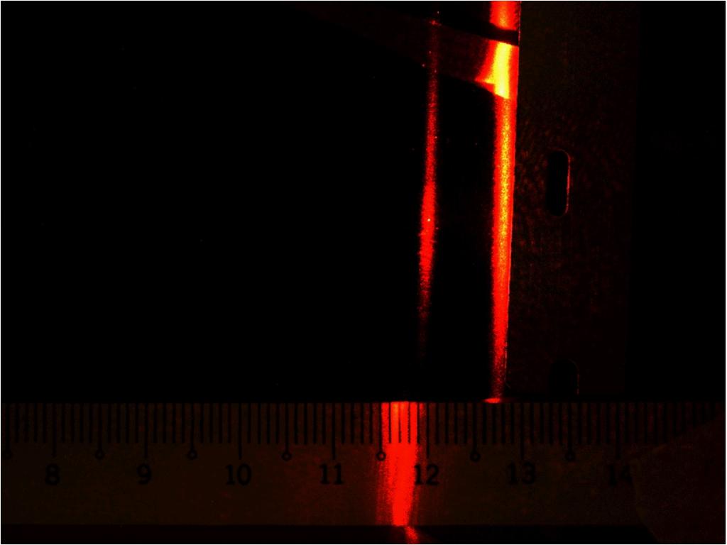 1 Experiment 1: manual recording For the first experiment, the set-up was as shown in Fig. 1. A laser beam was sent through a cylindrical lens, which projected a line of light onto the sample.