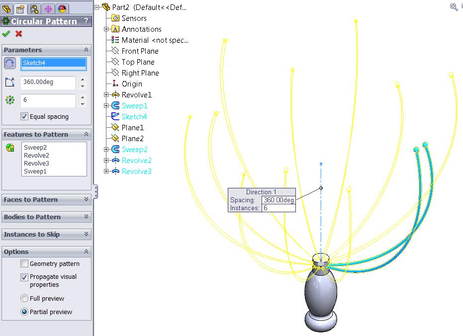 Using the Circular Pattern tool, under Features to Pattern select the two sweeps as well as the two revolved spheres.
