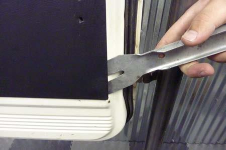 using a door trim tool.
