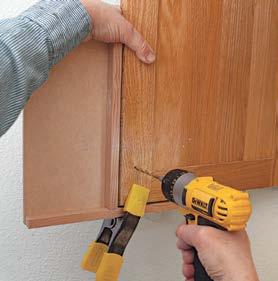 QUICK TIP Holding a scrap of wood behind the door as you drill eliminates blow out the messy exit