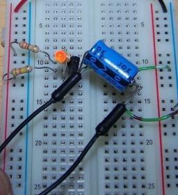 supply rail Insert LED into board Cathode [short leg] to same cross-row as Transistor Collector leg Other LED leg [+ive] to a 330 Resistor (orange, orange, brown) The other side of the resistor to