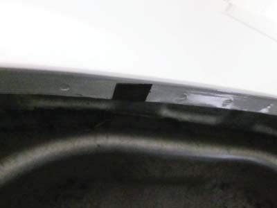 factory holes, aligning edge of Tab with inside edge of fender lip (Tab may extend over outside of fender).