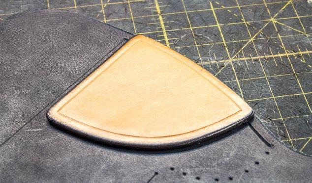 Trim and sand the edges of the reinforcement flush along the top edge of the holster opening.