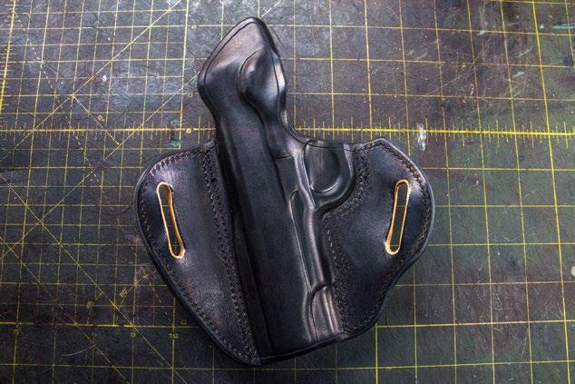 is more of a visual thing and difficult to teach with words alone. Otherwise, using your fingers, begin by pressing the leather inwards toward the gun so you can find the shape of the firearm.
