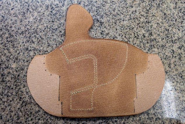 Sew the reinforcement piece onto the body of the holster. 17.