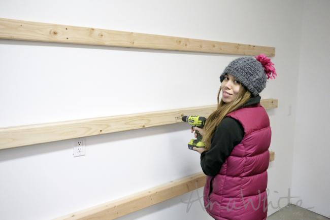 Simply screw 2x4s to studs in your wall wherever you want a shelf. You can put a shelf at any height.