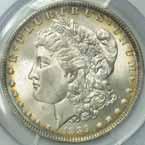 Nice original toning blankets the coin, starting as silvergold at the center and developing into rich tones of dove-gray, gold and finally turquoise at the rim....... #128871 $3895.00 1886-O. PCGS.