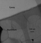 Figure 3a: TEM pictures of the interface Aluminum (lower part of the picture) /Epoxy coating (upper part).