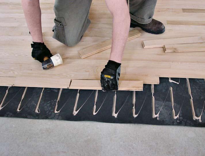 can glue down our solid wood floors directly to a concrete
