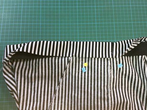 Make sure you cover the top of the pockets. Pin the waist in at least four places and sew at 1/8. Do not catch the elastic inside while sewing.
