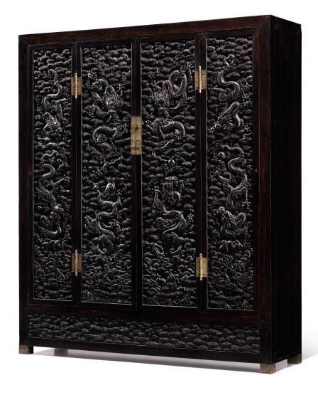 An Exceptional and Massive Cabinet with Zitan Carved Dragon Panels Qing Dynasty, 18th Century Height 241.5 cm / Length 208.3 cm / Depth 53.3 cm Est. HK$30 40 million / US$3.9 5.
