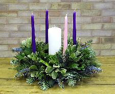The Advent Wreath: Make an Advent Wreath (this is a great activity for families), with five candles, (four around the outside, and one (the Christ Candle) in the middle.