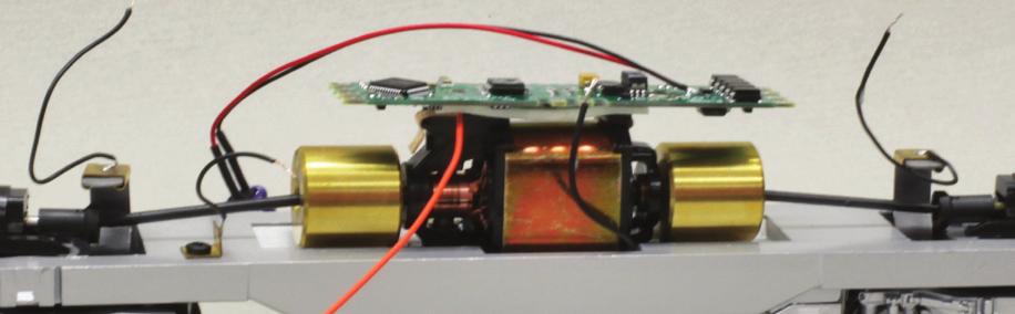 After these wires have been attached to the decoder, mount the decoder to the top of the motor using a piece of double-sided foam tape. (Photos 14 and 15) Photo 14 Photo 15 Photo 12 13.